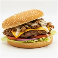Onze Pulled Burger combineert sappig pulled beef, cheddar kaas, luxe truffelmayo, frisse ijsbergsla, rode ui en tomaat. 